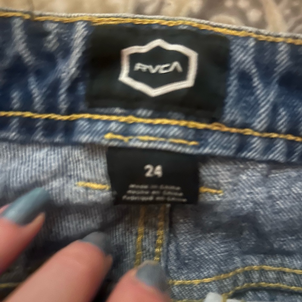 Barely worn mom jeans with distressing on front and back.